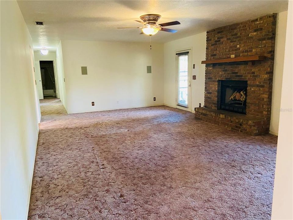 Large Living room with wood burning fireplace