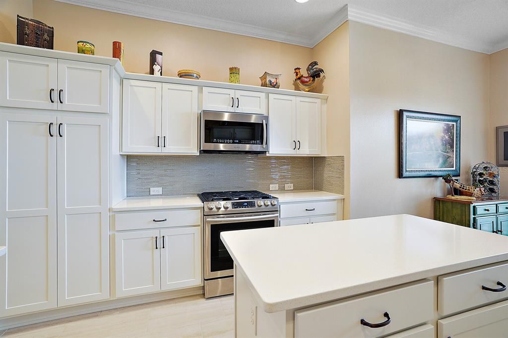 Kitchen with stainless steel and crown molding