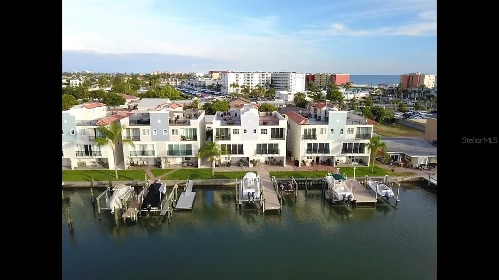 Waterfront with dock and roof top terrace