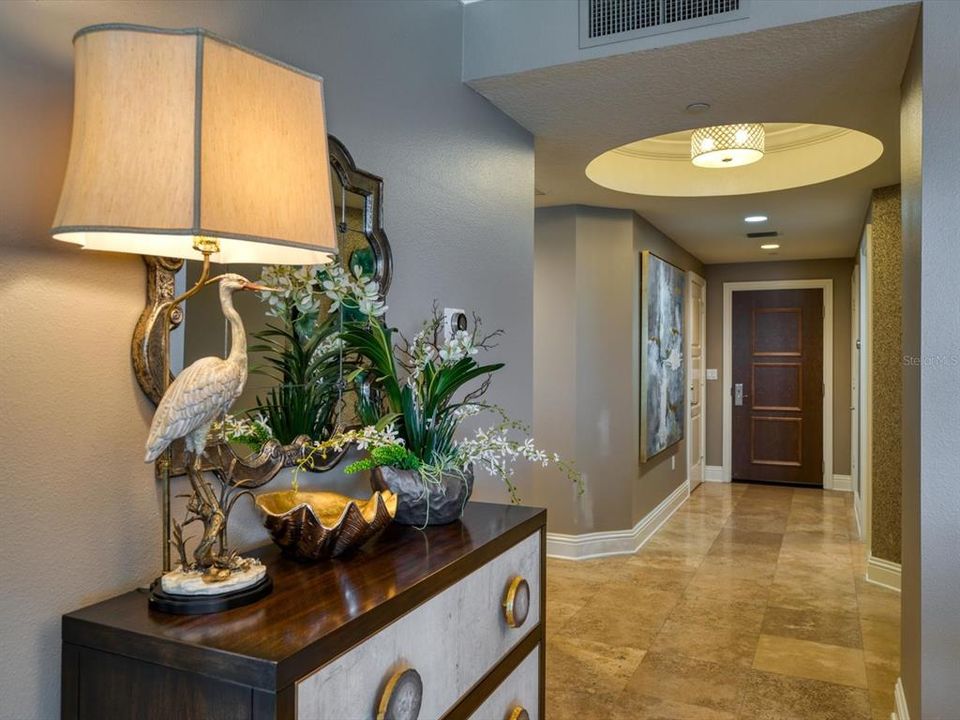 A spacious foyer greets you as you immediately notice the exquisite finishes throughout this impeccable home.
