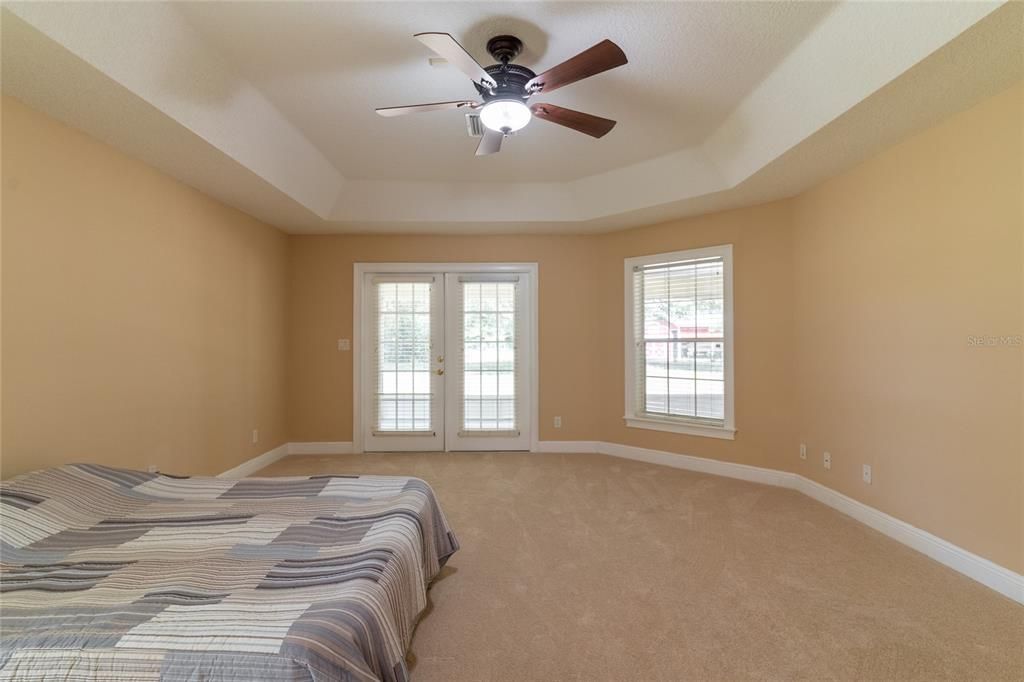 French doors lead to covered lanai