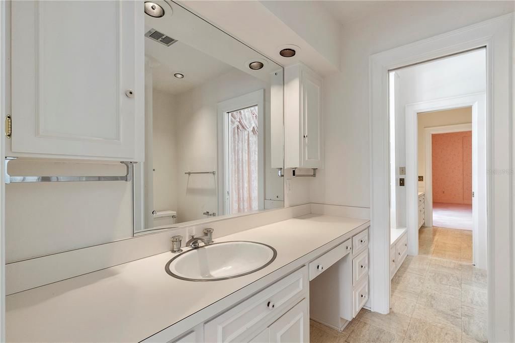 Two of these rooms are connected through a large "Jack & Jill" bathroom with plenty of storage and large vanities on each side.