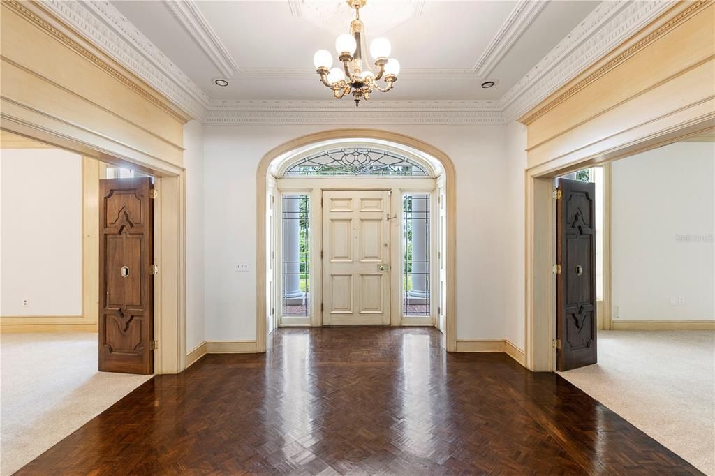 Gorgeous leaded glass surrounds the front entry door