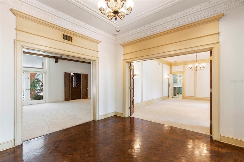 Directly adjacent to the foyer & formal dining is the oversized gathering room