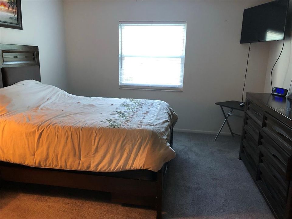 Nice sized main bedroom is light and bright.