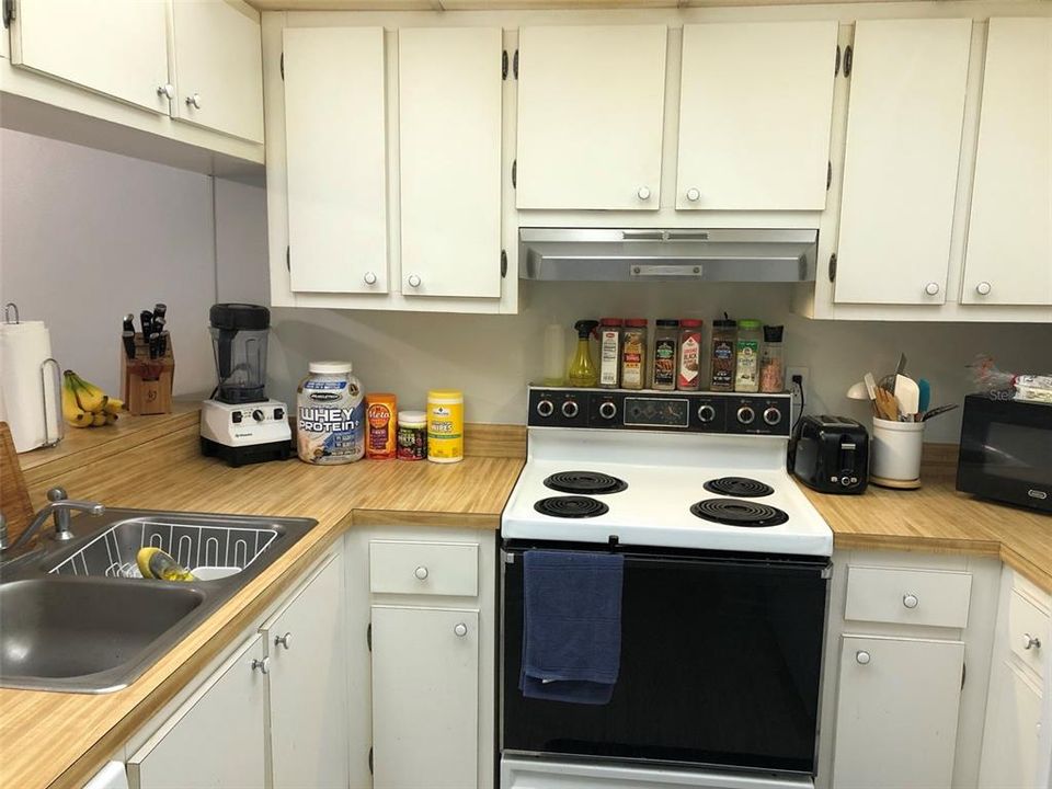 Comfortable galley kitchen. Refrigerator is to the right and has recently been replaced.