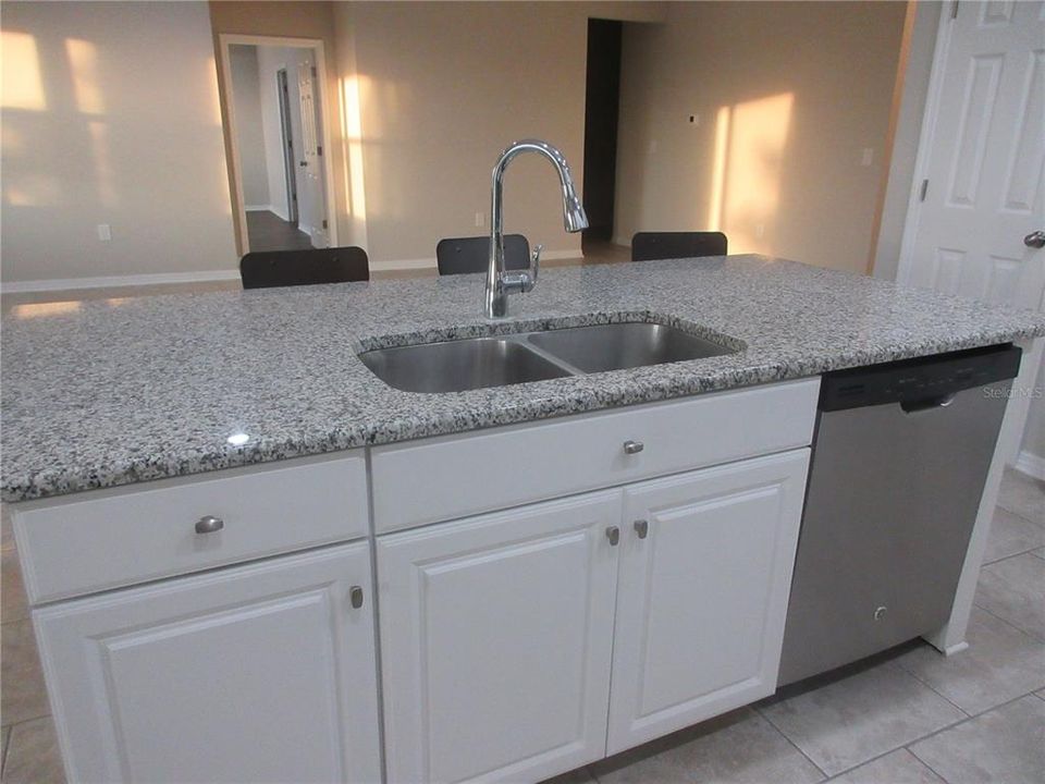 Island with sinks; Looking towards Master and hallway to bedroom 4