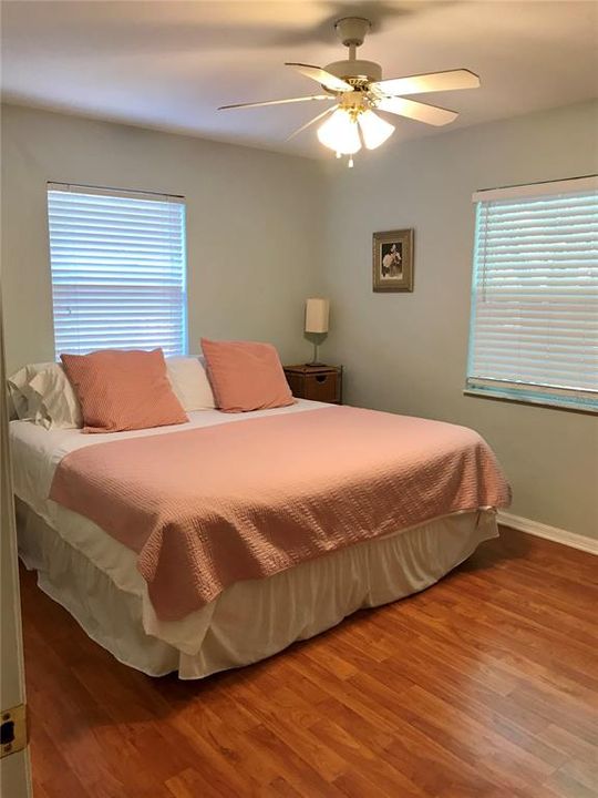 Master bedroom with King size bed & two windows for lots of light.