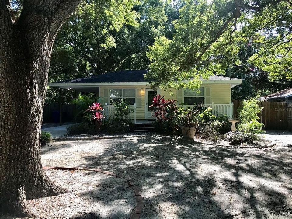 Adorable cottage, used as investment by owner.  2/1 and attached carport with utility room housing W/D.  Lush landscaping, gorgeous oak trees!  Old Florida at its very best.  Plenty of room for toys and Golf Cart allowable route,