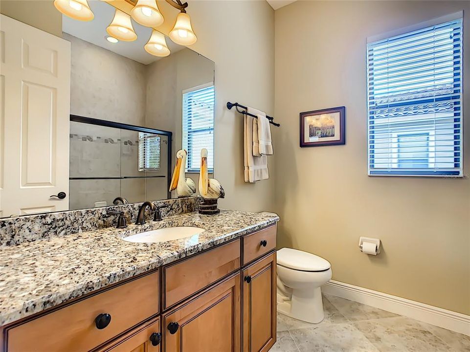 Guest Bath with Glass Enclosed Tub and Shower