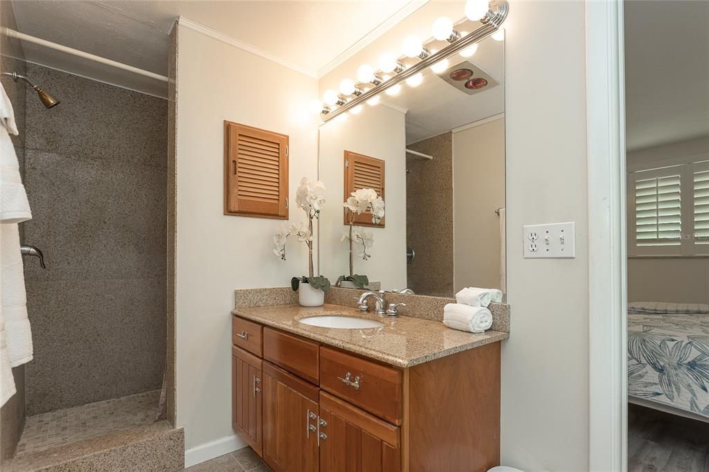 Bathroom 1 off the master offers granite countertops and flooring