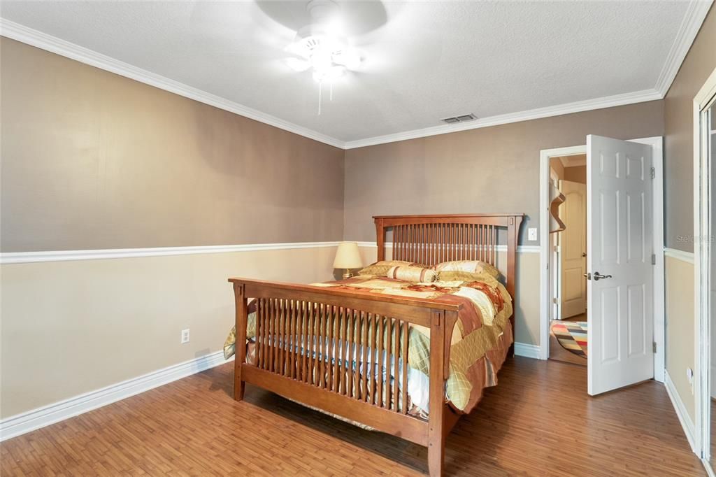 Bedroom three includes a chair rail and classic crown molding.