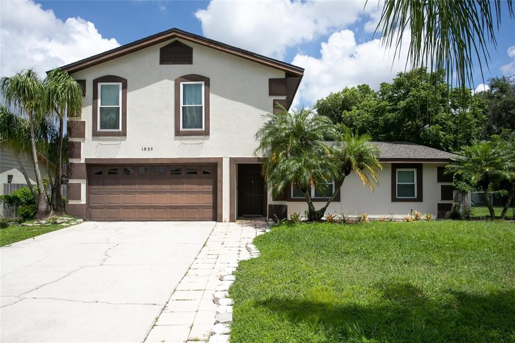 Swaying palm trees welcome you to this amazing Winter Park home!