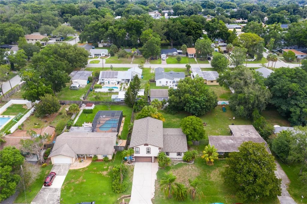 Front aerial view of property and surrounding neighborhood.