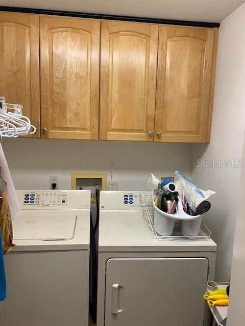 Very functional laundry room with laundry tub and shelving