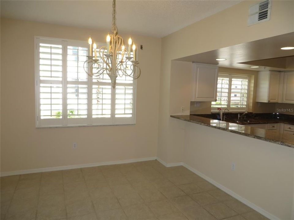 Dining room abuts the kitchen with a large bar.