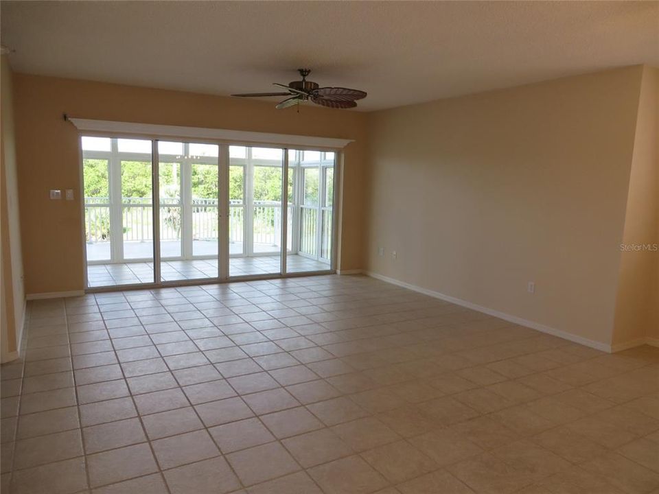 Large living room overlooks the water.