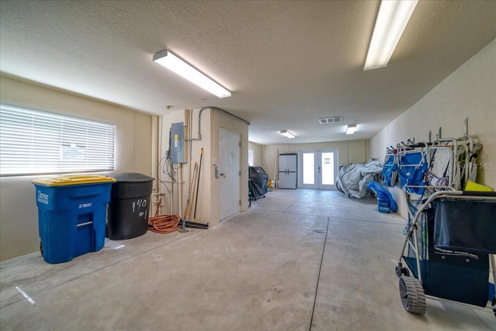 Ground floor level is a three car garage with extra storage. Others have converted some of this area to extra living area. Doors exit to a private outdoor sitting area overlooking the water, your boat slip and pool to the right.