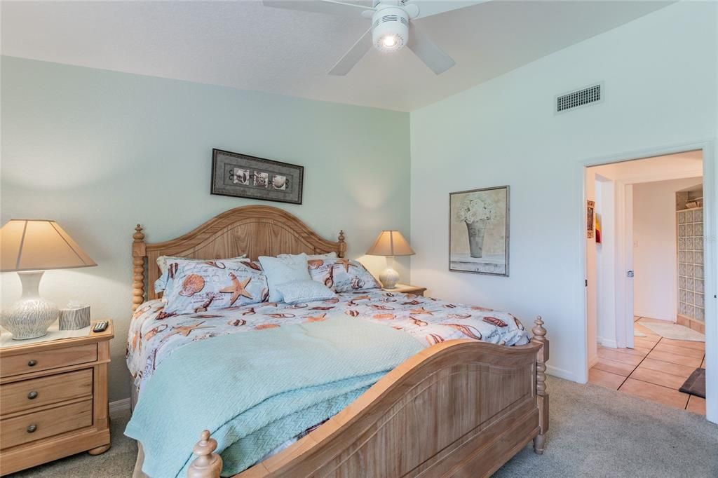 It???s not a bed, it???s an island!  The large king size bed anchors the spacious master bedroom.