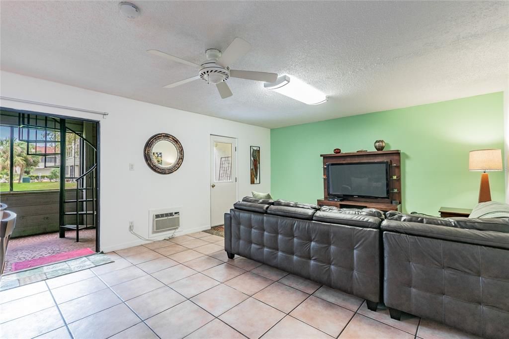 Ground floor decor includes another full leather sectional, entertainment system ...