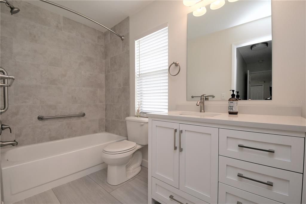 Hall bath beautifully remodeled with the same fixtures as the master bath!