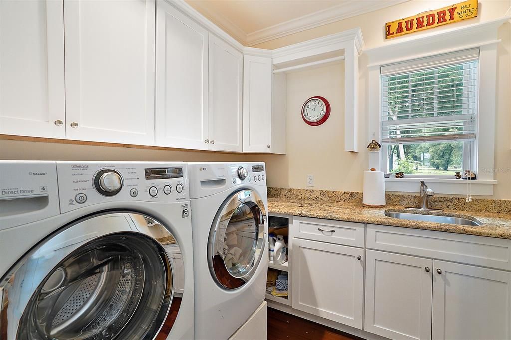 Laundry with Storage, Hanging Rack, Window and Sink