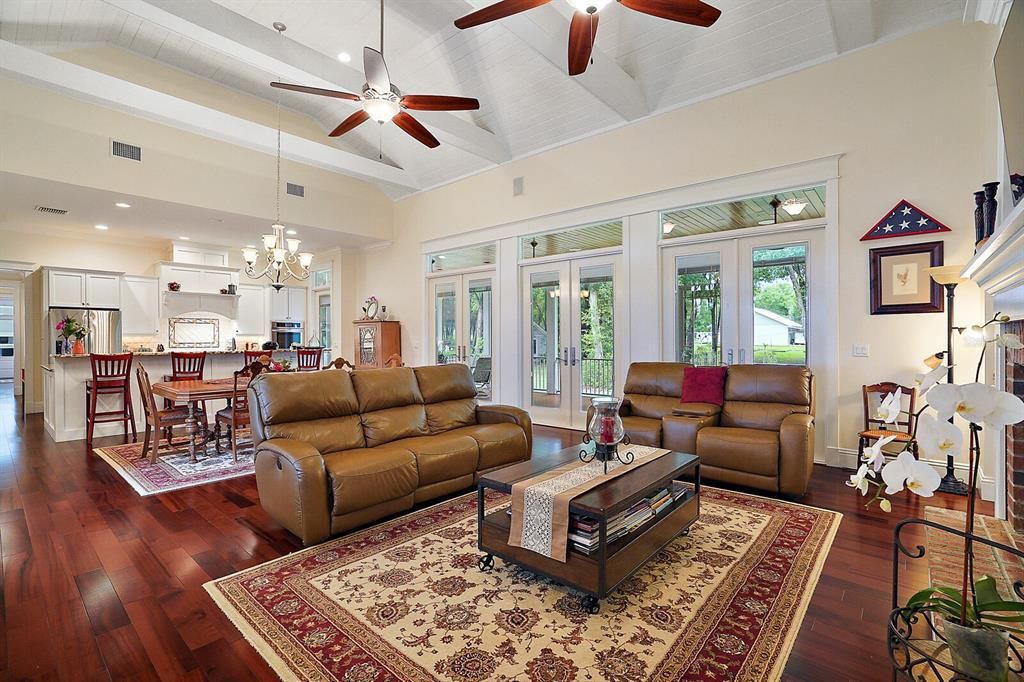 Open Floorplan with 3-Sets of French Doors and Glass Transoms Leading to the Back Porch