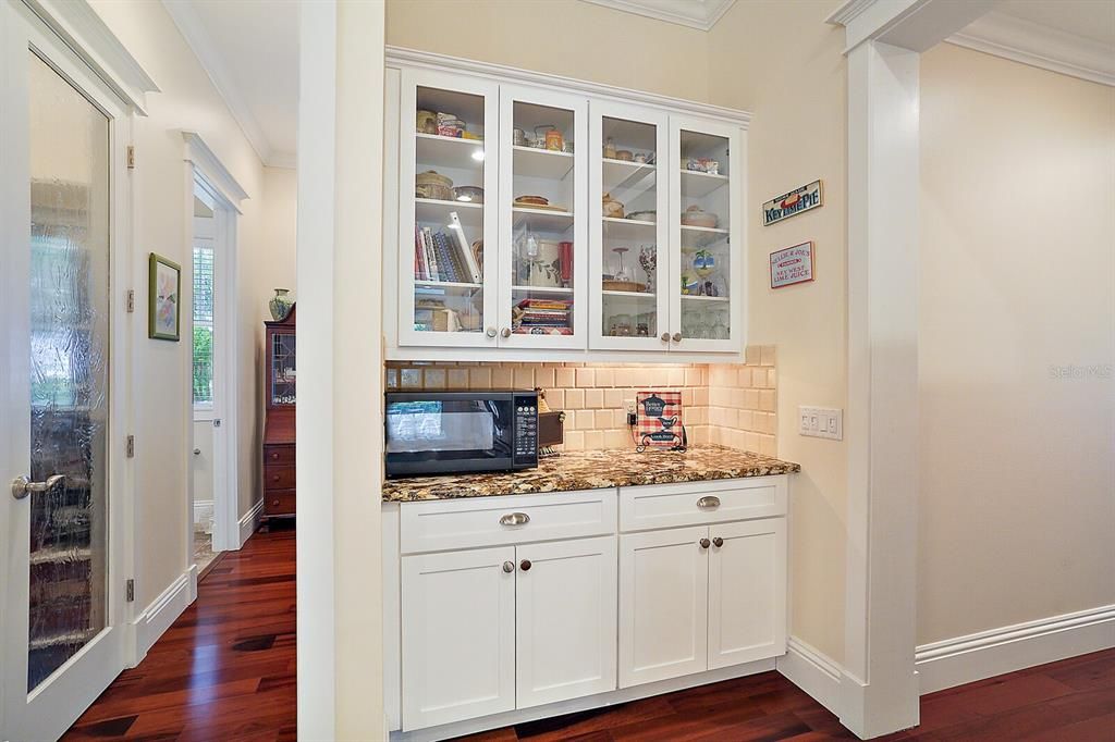 Butler's Pantry with Glass Cabinets, Granite Counters and Backsplash