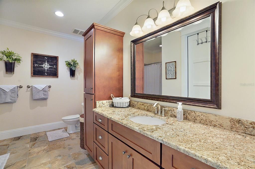 Bathroom Attached to Master Bathroom 2 with Granite Counters and Storage