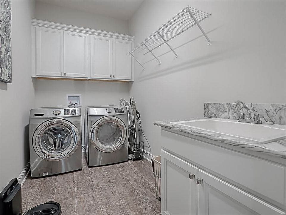 LAUNDRY ROOM WITH EXTRA CABINETS, GRANITE COUNTER AND BUILT-IN SINK!