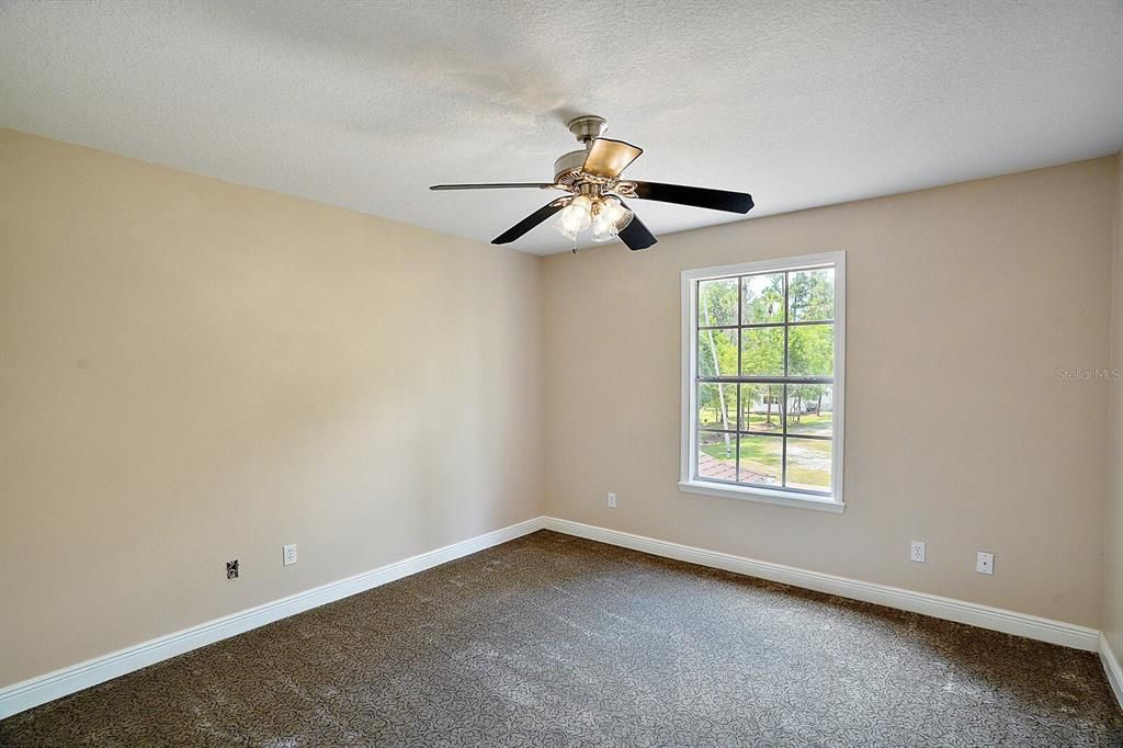 Bedroom 2 facing front of home, new carpet