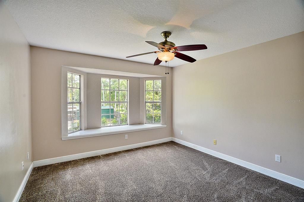 bedroom 3 with window seat overlooking canal