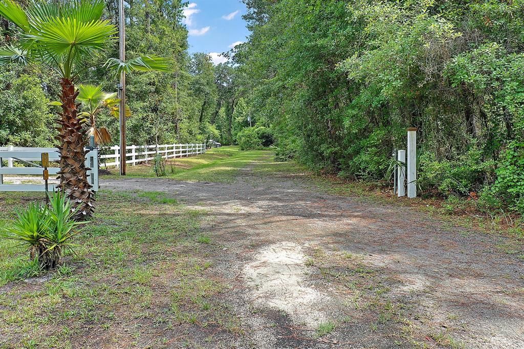 driveway has a gate to the property and is shared with adjoining property owner to the east of subject property