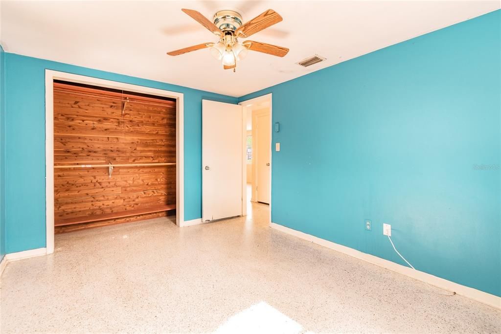 Blue bedroom 1 with its terrazzo and a cedar closet! Very Florida!