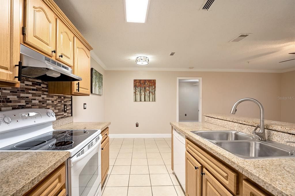 Newer appliances, GRANITE counters and custom cabinetry with lots of storage space.