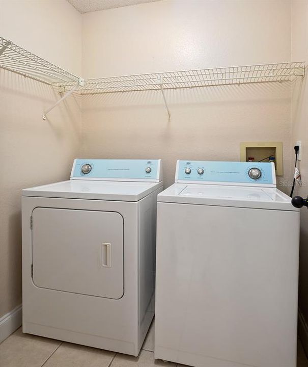 Roomy interior laundry room and washer and dryer are included.