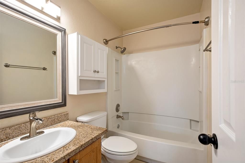 Master bathroom suite is privately situated right off the master bedroom. New cabinetry, fixtures and granite counter. Each bedroom has their own bathroom. Perfect for any living arrangements.