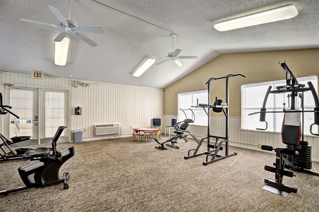 Private fitness room with security code entry. Gaze out at the pool while getting fit.