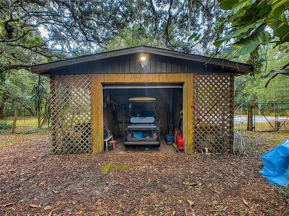 The largest of the 2 sheds easily accommodates the golf cart.