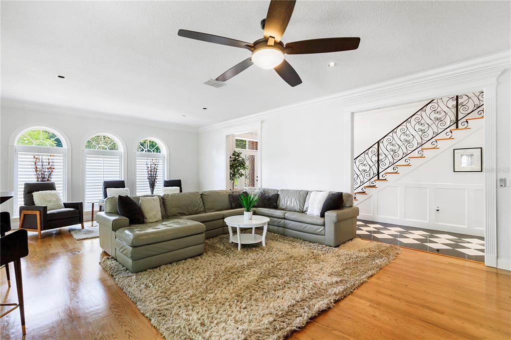 The oversized family room has gleaming hardwood floors and plenty of space to entertain.