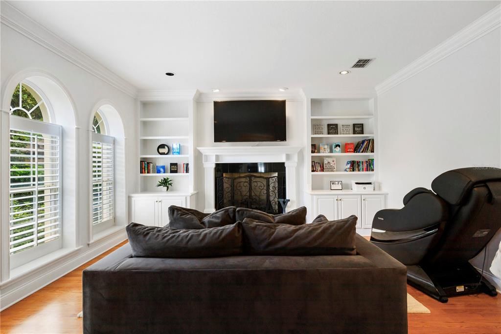This room features a gas fireplace, plenty of storage and custom built-ins.