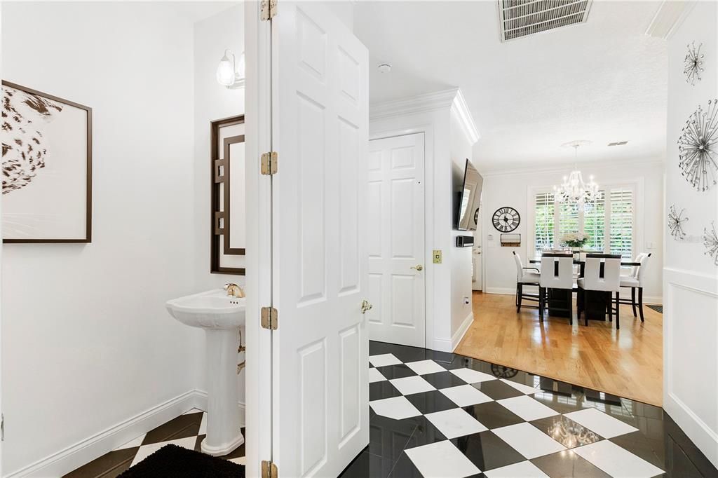 An adorable Half bath is tucked just under the staircase!