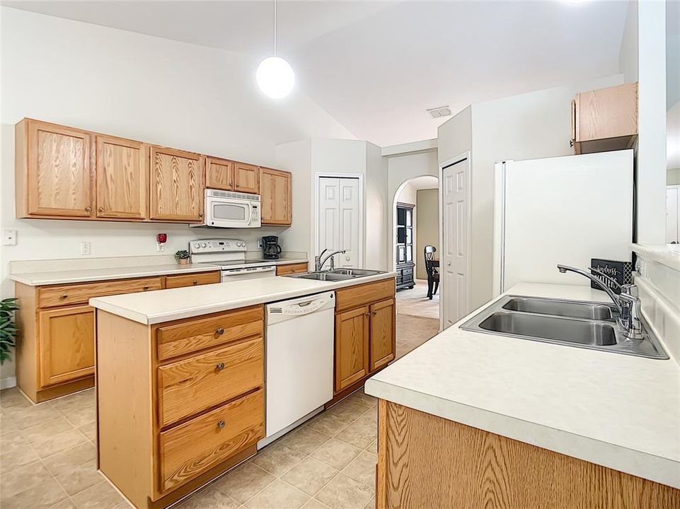 Kitchen has a large center island providing additional work space.