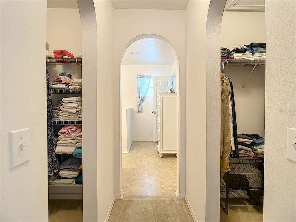 His and her walk-in closets are between the master bedroom and the master bath.