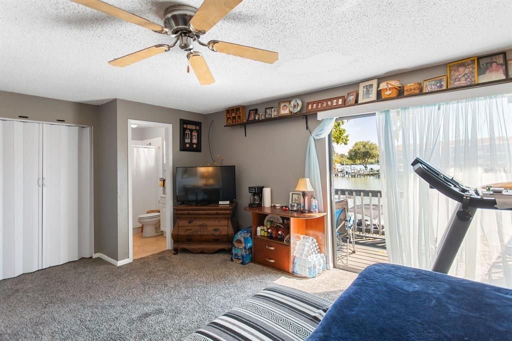 Upstairs bedroom, second closet and third bath. Sliding doors to full deck. Use this room as the Master bedroom or In-Law Suite. With it's own door to the outside, it could be a great Airbnb unit. Lots of possibilities.