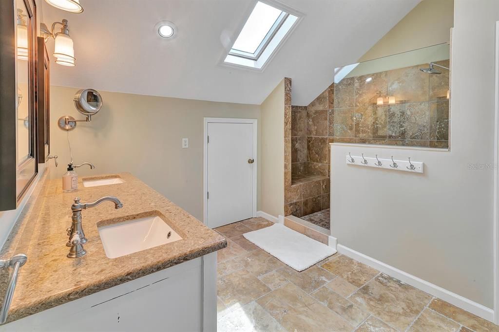 Master bathroom with walk in shower and private commode