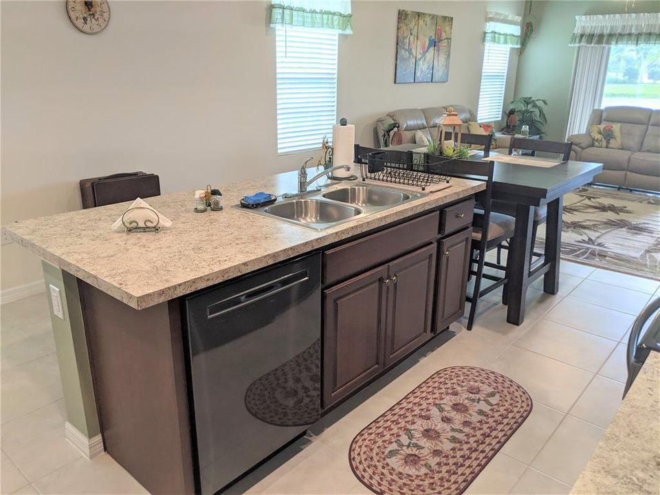 the dishwasher has been upgraded, also appreciate the comfortable distance in between the island and the rest of the kitchen, wheel chair access without any problem.