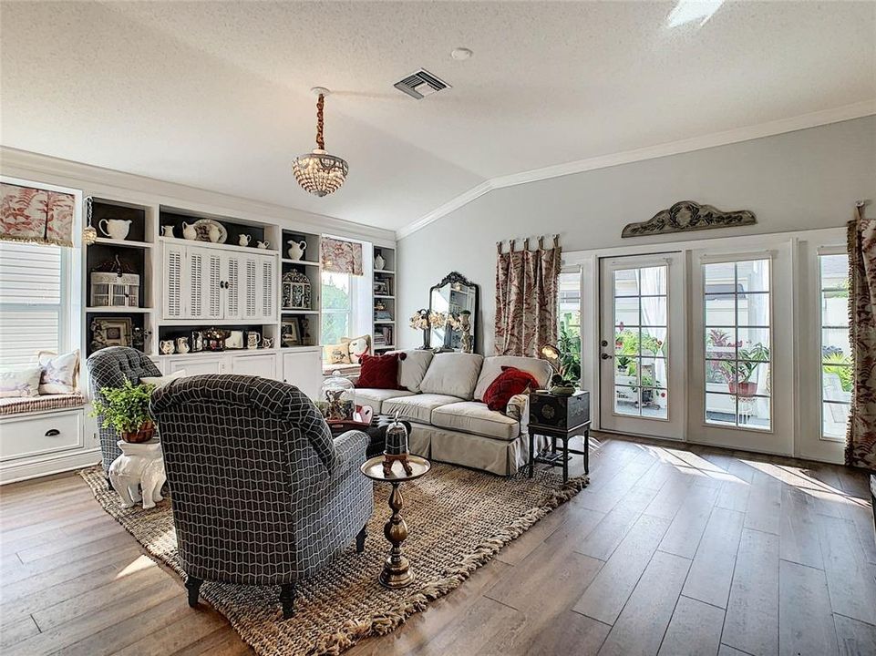 GORGEOUS FLOORING, FRENCH DOORS, NOTICE THE BUILT IN TV UNIT