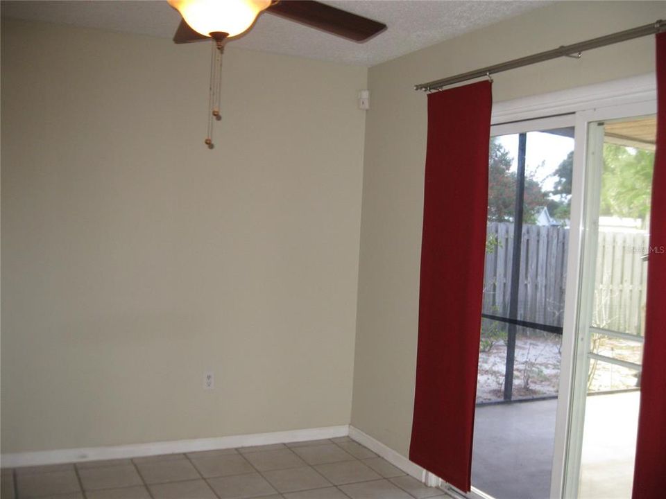DINING ROOM HAS CEILING FAN/LIGHT AND SLIDING GLASS DOORS TO SCREENED LANAI.