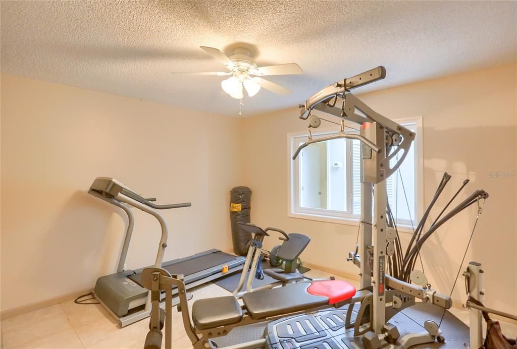 2nd bedroom that is being utilized as a home gym.